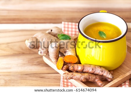 cup of Turmeric Tea with lemon and ginger , Benefits for reduce Inflammation , Liver Detox and Cleanser healthy herb drink concept