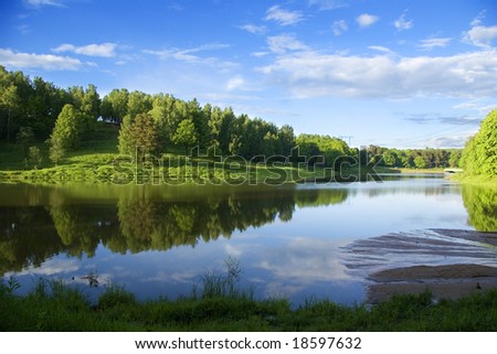 Blue reflection in river  at summer forest, Russia, Krasnogorsk