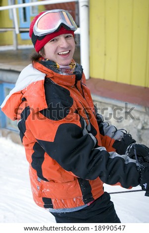 A health lifestyle image of young adult snowboarder