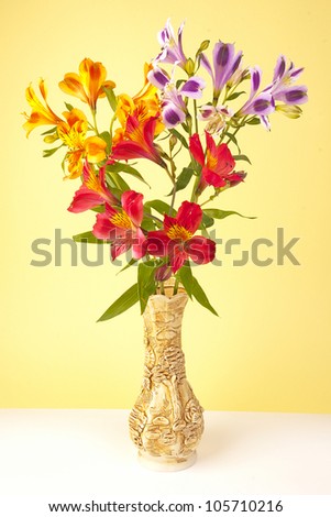 Bunch of flowers in a vase it is removed in studio