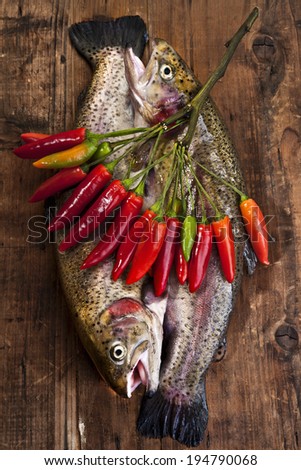 raw trouts with chilly peppers