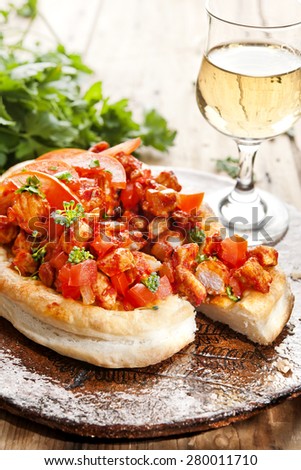 Mini puff pastry pizzas topped with tomatoes, veal and herbs  pastry pie,  with tomatoes, mini pizza