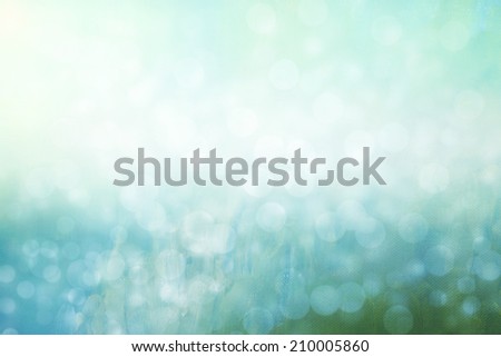 abstract white blue and green cold background with glitter boke