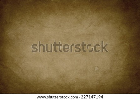 old paper texture or background with creases and dark vignette borders