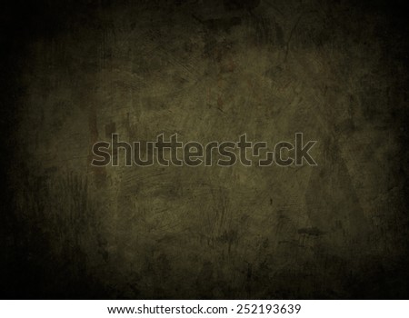 green abstract background or texture with black vignette borders