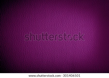 fuchsia leather background or texture with dark vignette borders