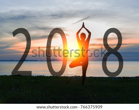 Yoga Happy new year card 2018. Silhouette woman practicing yoga