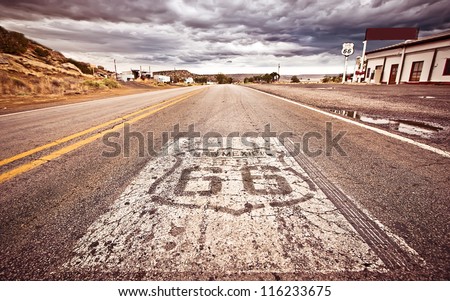 An old Route 66 shield painted on road