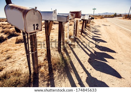 Grunge mail boxes in a row at Arizona desert USA