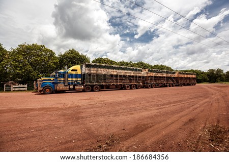 NORTHERN TERRITORY, AUSTRALIA - JANUARY 12, 2013: Roadtrains in desert in Northern Territory on January 12, 2013, Australia. A roadtrain use in remote areas of Australia to move freight efficiently.
