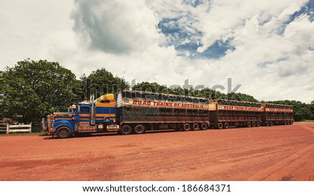NORTHERN TERRITORY, AUSTRALIA - JANUARY 12, 2013: Roadtrains in desert in Northern Territory on January 12, 2013, Australia. A roadtrain use in remote areas of Australia to move freight efficiently.