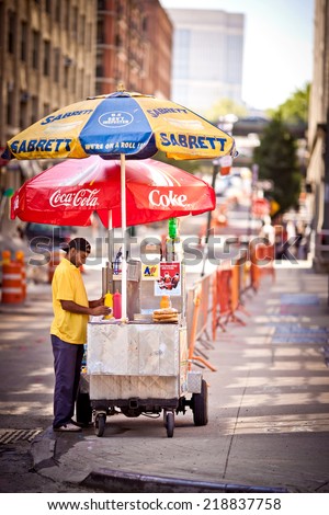 BROOKLYN, NEW YORK - JULY 7, 2011: Male street vendor of hot dogs on the streets of New York on July 7, 2011, Brooklyn, USA