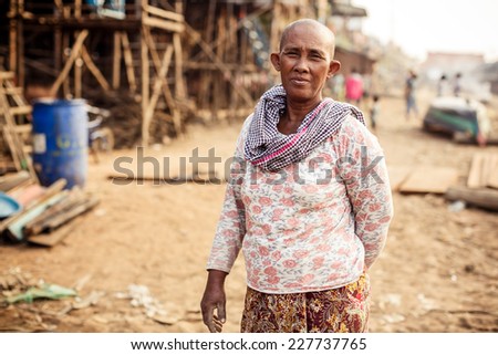 KAMPONG PHLUK,CAMBODIA - JANUARY 01: Portrait of an unidentified Khmer woman on Tonle Sap Lake in Kampong Phluk,Cambodia on 01.2014 January .It is the largest lake in Southeast Asia