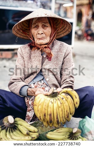 HUE,VIETNAM - DECEMBER 28: Vietnamese street vendor sell banana in Hue on December 28,2013,Vietnam