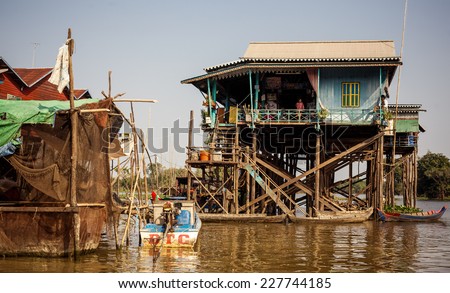 TONLE SAP, CAMBODIA-01 JANUARY 2014: Homes on stilts on the floating village of Kampong Phluk on the Tonle Sap lake on 01.2014 January. It is the largest lake in Southeast Asia