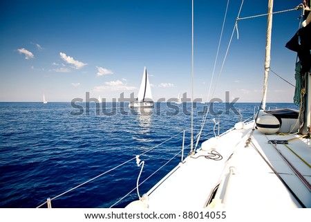 Sailing ship yacht with white sail in open sea