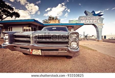 TUCUMCARI, NM - JULY 11: Blue Swallow Motel and old car on Historic Route 66 on July 11, 2011 in Tucumcari, NM. The Blue Swallow has been serving travelers along the Mother Road since 1939.