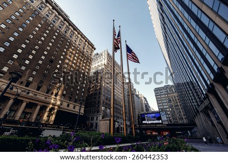 NEW YORK, UNITED STATES - SEPTEMBER 10: Typical below view from street on famous skyscrapers on September 10, 2014 in New York, USA