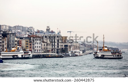 ISTANBUL, TURKEY - NOVEMBER 28: Floating ship and city buildings in Istanbul, Turkey on November 28, 2014