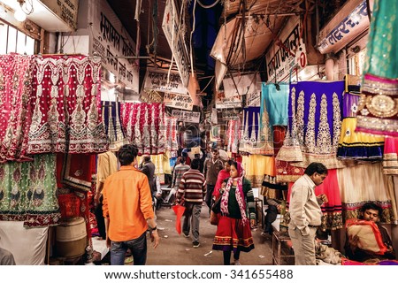 JAIPUR, INDIA - JANUARY 9, 2015: People in local textile shop of traditional indian sari on January 9, 2015 in Jaipur, India