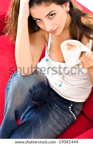 Beautiful smiling lady waking up and drinking coffee