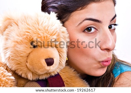 Happy pretty woman with teddy bear