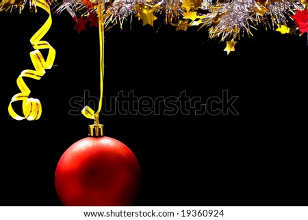 Hanging Christmas ornament over black background
