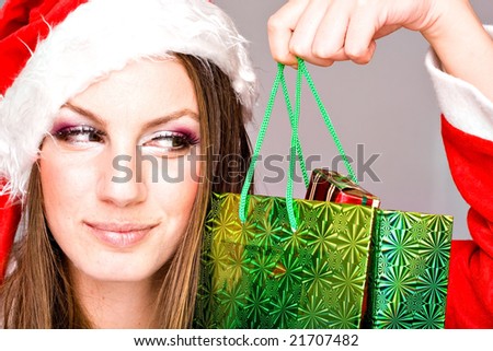 lovely santa helper girl with gift bags