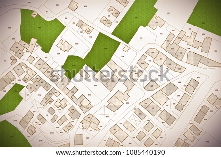 Imaginary cadastral map of territory with buildings, roads, land parcel and free green land available for building construction. Concept image