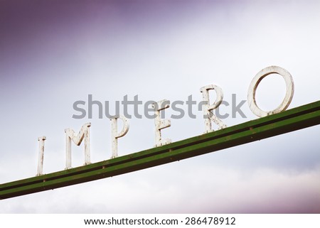 The word Empire written in the Italian language with wooden letters - toned image