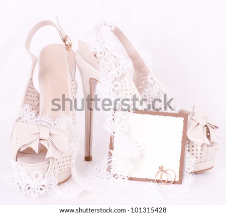 The beautiful bridal shoes, lace and wedding rings with banner add