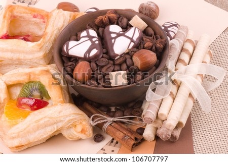 Coffee beans and cinnamon, nuts, fruit cake