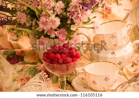Vintage elegant tea set, flowers and raspberry