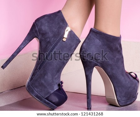 female shoes on a pink background