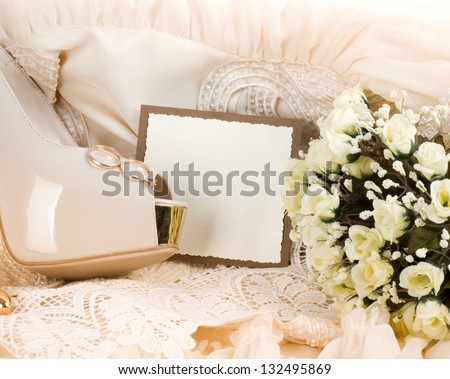 The bridal shoe, flowers and wedding rings with banner add