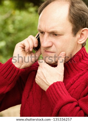 Happy man answering the phone