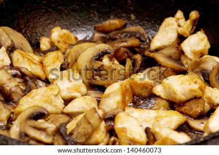 fried mushrooms in a pan closeup
