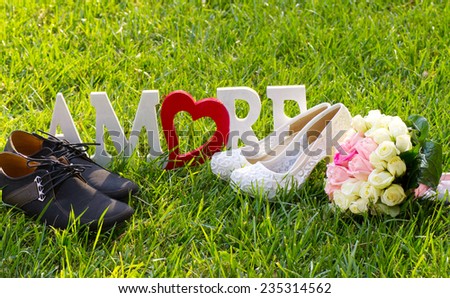 Bridal and groom shoes and bouquet