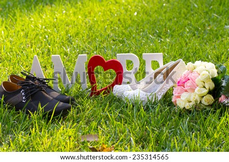 Bridal and groom shoes and bouquet