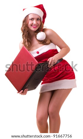 Beautiful young girl in Santa Claus clothes with notebook on white background.