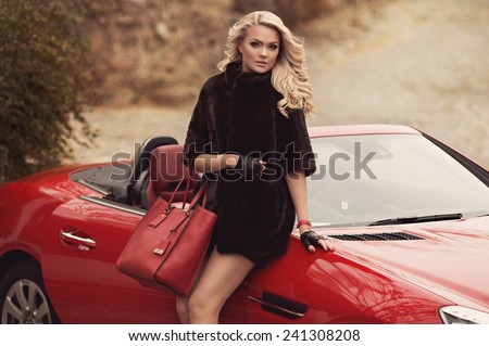 Portrait of beautiful young woman with makeup in fashion clothes on hature