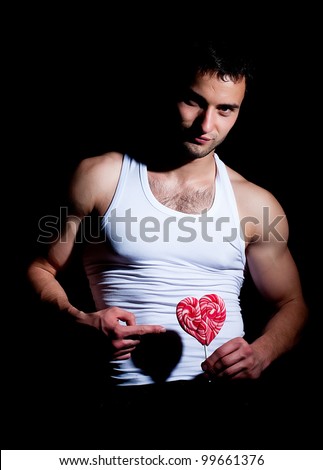 stock-photo-fashionable-muscular-man-with-red-lollipop-99661376.jpg