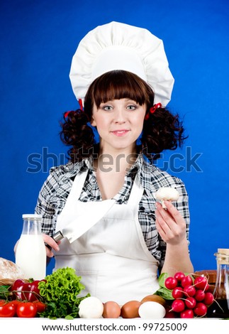Smiling happy cook woman with food ingredients