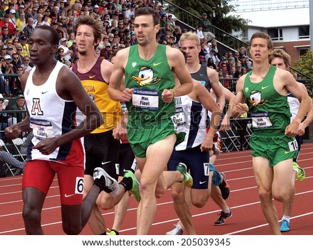 Eugene, Oregon June 12, 2014 - The University of Arizona\'s Lawi Laland leads the pack trailed by the University of Oregon\'s Mac Fleet in the men\'s 1500m race at the 2014 NCAA T & F Championships