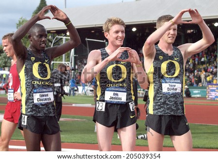 Eugene, Oregon June 12, 2014 - Teammatess Edward Cheserek (L), Eric Jenkins (C) and Trevor Dunbar (R) salute the crowd after the men\'s 5000m race at the 2014 NCAA Track & Field Championships