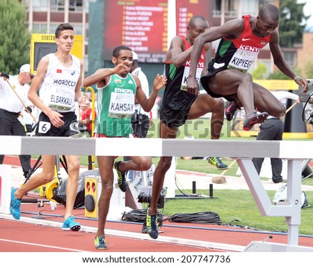 July 27, 2014 Eugene, Oregon - Kenyans Barnabas Kipyego and Titus Kibiego lead Maresa Kahsay of Ethiopia and Soufiane Elbakkali of Morocco over a barrier at  the 2014 IAAF World Junior Championships.