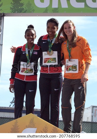 July 27, 2014 Eugene, Oregon - USA teammates Kendall Williams (gold) and Dior Hall (silver) join the Netherlands\' Nadine Visser (bronze) on the awards stand at the 2014 IAAF Junior World Championships