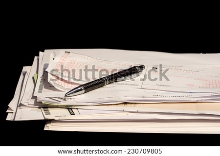 stack of paperwork and bills to pay