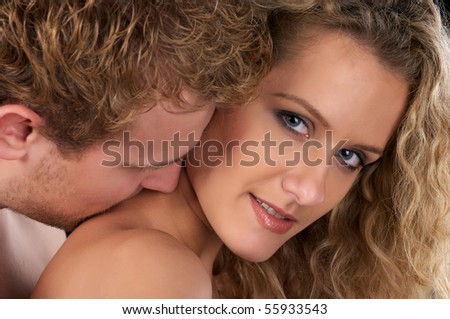 stock photo Closeup portrait of beautiful naked couple He kiss her neck