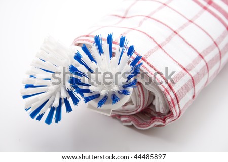 Dishes cloth with washing-up brush